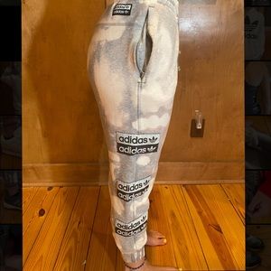 Tie-dye distressed Adidas sweatpants